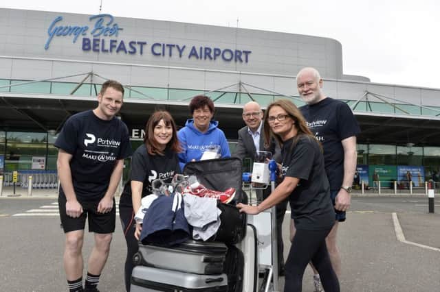 Grant Thornton NI managing partner Richard Gillan (third right) and Make-A-Wish fundraising manager Gail McKee (third left) with  members of specialist fit-out firm Portviews five teams Paul McNeill, Amy Black, Karen Fullerton and Portview MD Simon Campbell