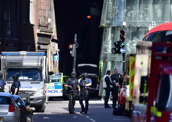 Armed police outside Borough Market, London, near the scene of last night's terrorist incident.