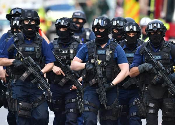 Armed police on St Thomas Street, London, near the scene of last night's terrorist incident at Borough Market