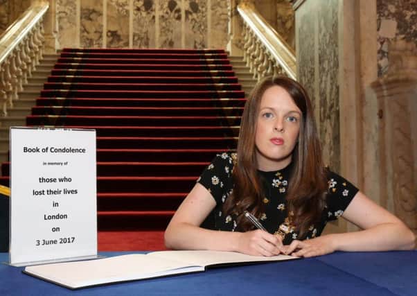 The Lord Mayor of Belfast, Councillor Nuala McAllister, opens a Book of Condolence in City Hall for the victims of the London attacks. Councillor McAllister was the first to sign the book which will be available for signing in the main entrance hall during normal City Hall opening hours (8.30 am - 5pm Monday to Friday, 10am - 4pm Saturday and Sunday).