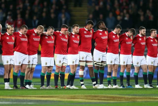 British and Irish Lions players stand for a minute's silence in memory of the victims of the London terror attacks before the tour match at Eden Park