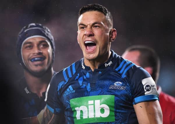 Blues' Sonny Bill Williams celebrates scoring their second try against the Lions
