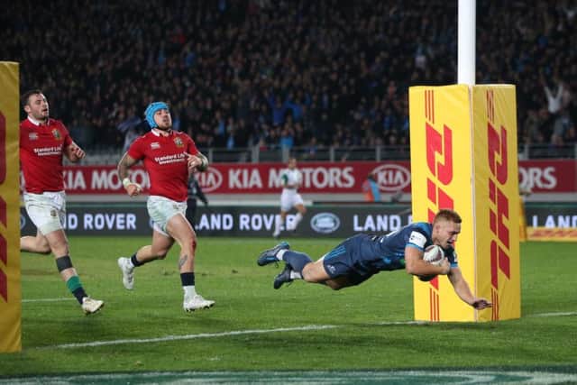 Blues' Ihaia West scores the winning try against the Lions