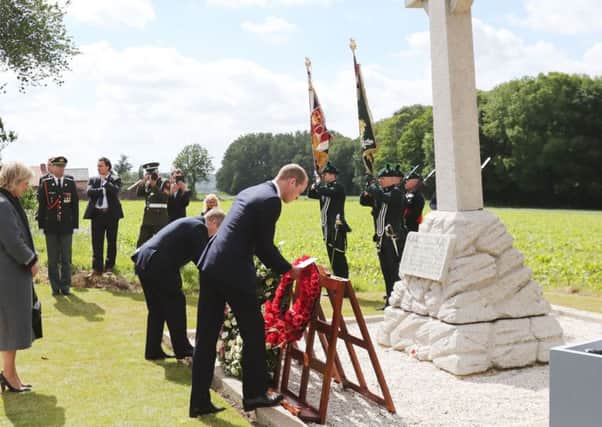 The Duke of Cambridge (right) and Taoiseach Enda Kenny lay wreaths at the foot of a gigantic cross