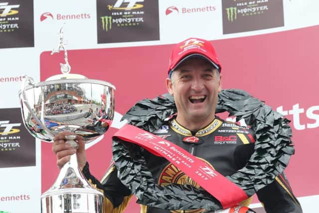 A delighted Michael Rutter with the Lightweight TT trophy.