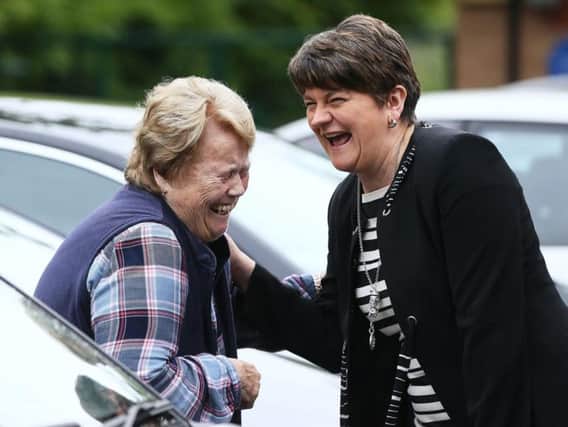 Arlene Foster meets a friend after voting