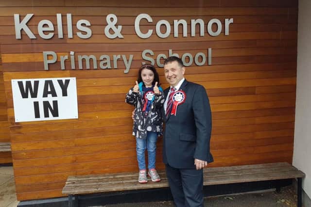 Ulster Unionist Party handout photo of party leader Robin Swann with his daughter Freya after voting in the 2017 General Election at Kells & Connor Primary School in Co Antrim.