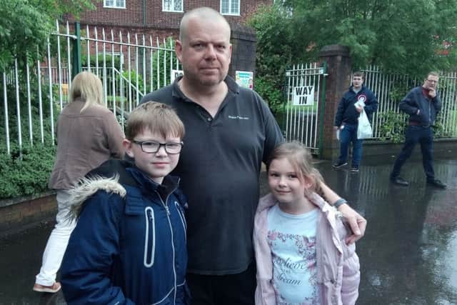 Voted Alliance: Clive Harden, age 47, with his children Joseph and Emily (voted Alliance because back home in England he voted Lib Dem and Alliance is closest to that). He moved from Sidcup 16 years ago
Pictured at Elmgrove Primary School, a voting station on the Beersbridge Road in East Belfast. Thursday June 8 2017. By Ben Lowry