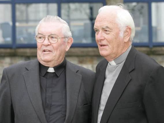 Mandatory credit Liam Burke Undated handout photo issued by Concern Worldwide of Father Aengus Finucane and his brother Father Jack Finucane (right) who has died