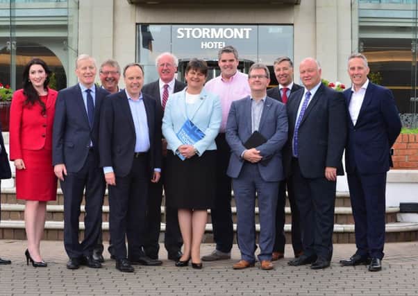DUP leader Arlene Foster (centre) with the DUPs 10 MPs who will support the minority government of Theresa May
