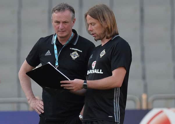Northern Ireland boss Michael O'Neill talking tactics in Baku with assistant coach Austin MacPhee. Pic by Pacemaker.