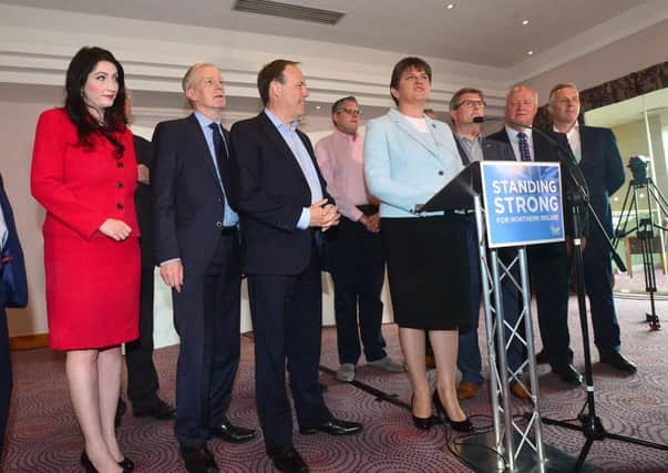 DUP leader Arlene Foster pictured with her newly elected MPs during a press conference at Stormont Hotel in Belfast last week