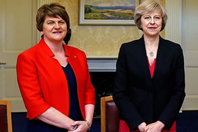 Arlene Foster (left), leader of the Democratic Unionist Party, with Prime Minister Theresa May. Their parties are now propping up the government. Photo: Charles McQuillan/PA Wire