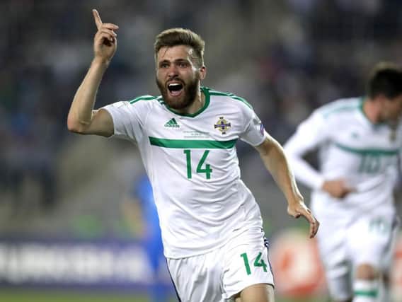 Stuart Dallas wheels away in celebration having netted a last-gasp winner for Northern Ireland in their World Cup qualifier away to Azerbaijan. Photos: Press Eye