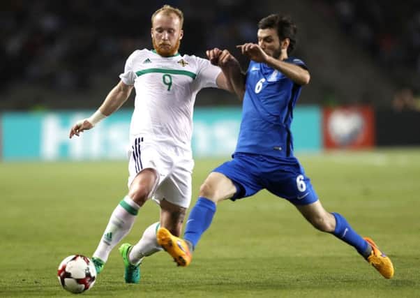 Azerbaijan's Badavi Huseynov with Northern Ireland's Liam Boyce