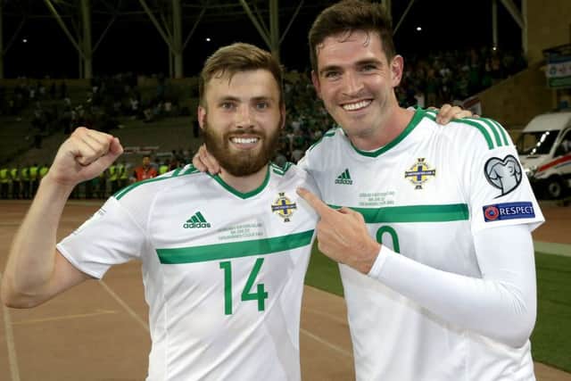 Northern Ireland's Stuart Dallas celebrates with Kyle Lafferty after scoring against Azerbaijan