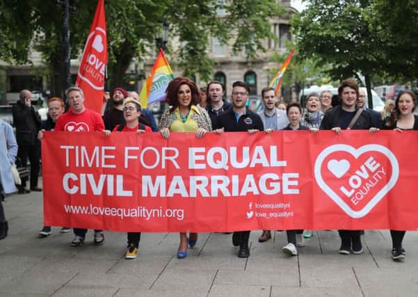 Campaigners from the Love Equality Coalition  as they announce a march for Equal Marriage outside City Hall in Belfast to be held in on July 1