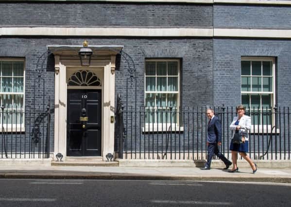 DUP leader Arlene Foster and DUP deputy leader Nigel Dodds arriving at 10 Downing Street in London for talks on a deal to prop up a Tory minority administration: Tuesday June 13, 2017