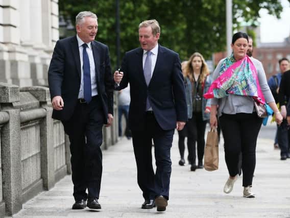 Outgoing Taoiseach Enda Kenny (right) arrives at Government Buildings, Dublin, for his last day as Taoiseach