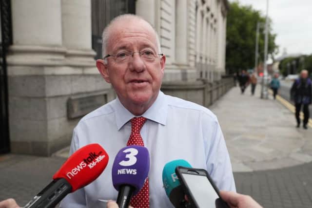 Minister for Foreign Affairs Charlie Flanagan arrives at Government Buildings, Dublin, on what is outgoing Taoiseach Enda Kenny's final day