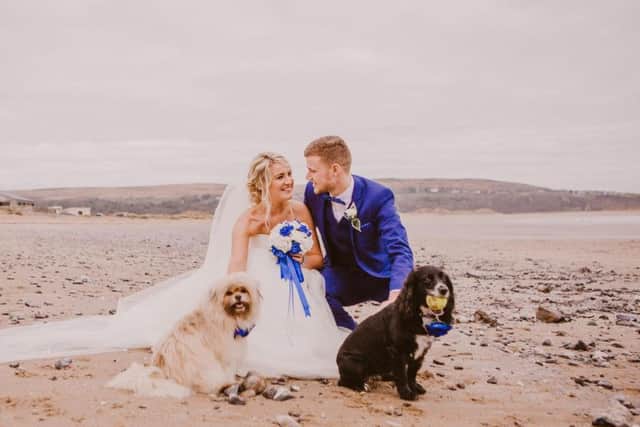 Undated Lauren Owens Photography handout photo issued by the Dogs Trust of dog-mad bride Kim Davies, 29, and her new husband Jason who were escorted down the aisle to exchange their vows by Maddie (right) and Flea, both of whom were rescued by Mrs Davies.