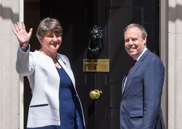 DUP leader Arlene Foster and deputy leader Nigel Dodds head into 10 Downing Street onTuesday for talks with Theresa May