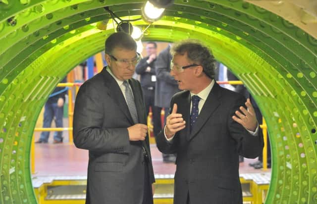 Michael Ryan guides the Duke of York during a visit to the Bombardier facilty in 2015