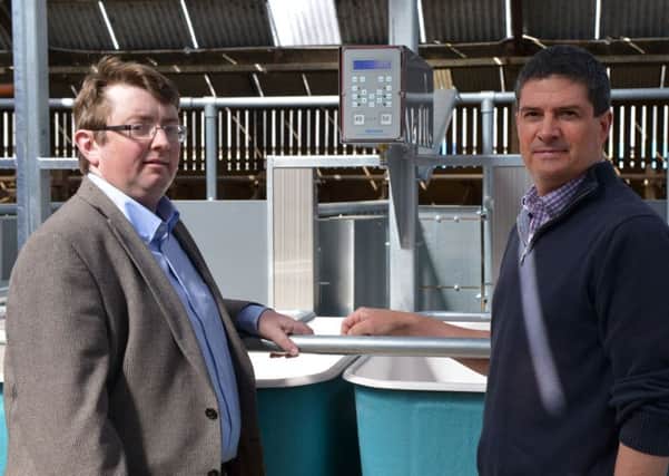 Conrad Ferris (AFBI), pictured right and Jason Rankin (AgriSearch) discuss the new individual cow feed intake and feeding behaviour monitoring equipment that will be used in precision feeding studies at AFBI, Hillsborough