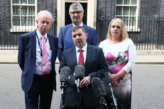 Robin Swann and other members of the Ulster Unionist Party speaking to the media after talks at 10 Downing Street, London, as negotiations continue between Theresa May's Conservatives and the Democratic Unionist Party (DUP) over a deal under which the Northern Irish party could prop up a minority Tory administration