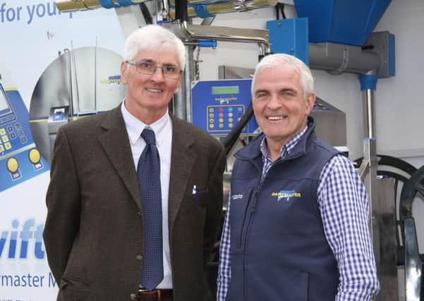 Holstein UK president elect David Perry discusses plans for the two-day Holstein Celebration and AGM with Sean Reid, Cookstown Dairy Services, sponsor. Picture: Julie Hazelton