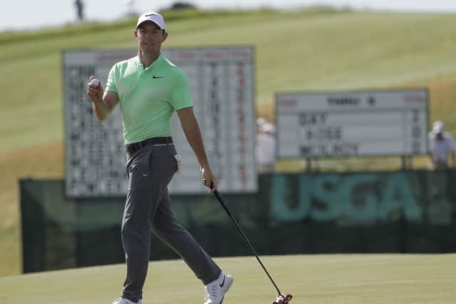 Rory Mcilroy, of Ireland, reacts on the ninth hole during the first round of the U.S. Open