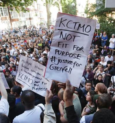 Protesters outside Kensington town hall in west London, the headquarters of the Royal Borough of Kensington and Chelsea, demanding answers over the Grenfell Tower disaster. PRESS ASSOCIATION Photo. Picture date: Friday June 16, 2017. See PA story FIRE Grenfell TownHall. Photo credit should read: Yui Mok/PA Wire