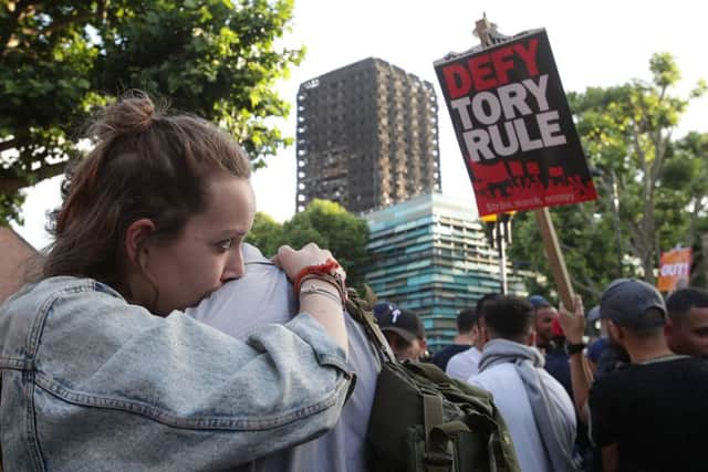 Protesters close to Grenfell Tower in west London after a fire engulfed the 24-storey building on Wednesday morning. PRESS ASSOCIATION Photo. Picture date: Friday June 16, 2017. See PA story FIRE Grenfell TownHall. Photo credit should read: Yui Mok/PA Wire