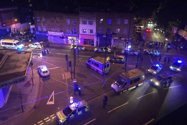 Emergency services at the scene in Seven Sisters Road (Thomas Van Hulle/PA)