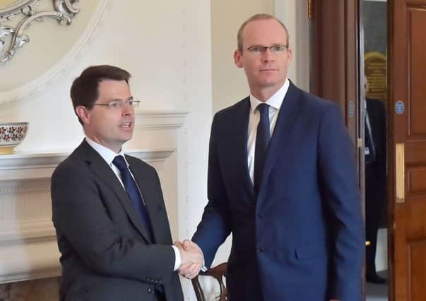 Northern Ireland Office handout photo of Northern Ireland Secretary of State James Brokenshire with Irish Foreign Minister Simon Coveney, who has said that the start of Brexit negotiations in Brussels underline the urgent need to restore powersharing in Northern Ireland