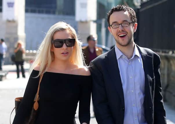 Model Laura Lacole arrives at the High Court with Richy Thompson of Humanist UK