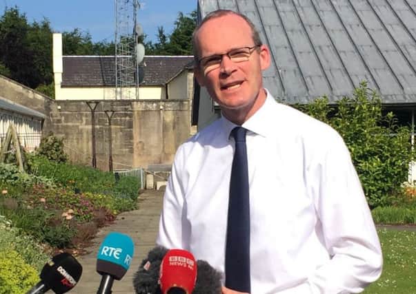 Irish foreign minister Simon Coveney speaking to media at Stormont Castle, Belfast. David Young/PA Wire