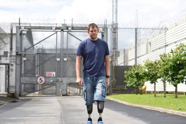 Undated handout photo issued by the Department of Justice of Afghanistan veteran Duncan Slater, who lost both legs in a bomb blast, visiting prisoners in HMP Maghaberry in Northern Ireland.