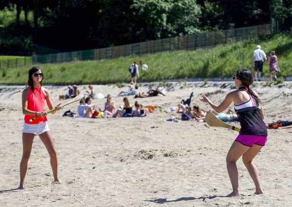 Orlagh McCollum (left) and Rachel Mulholland enjoying the weather at Crawfordsburn Country Park beach, Helen's Bay, Northern Ireland on Wednesday June 21, the summer solstice. Photo: Liam McBurney/PA Wire