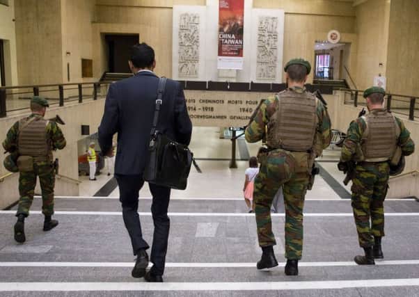 Belgian Army soldiers patrol inside Central Station in Brussels on Wednesday, June 21, 2017. Belgian authorities said they foiled a "terror attack" when soldiers shot a suspect in the heart of Brussels after a small explosion at a busy train station Tuesday on a night that continued a week of attacks in the capitals of Europe. (AP Photo/Virginia Mayo)