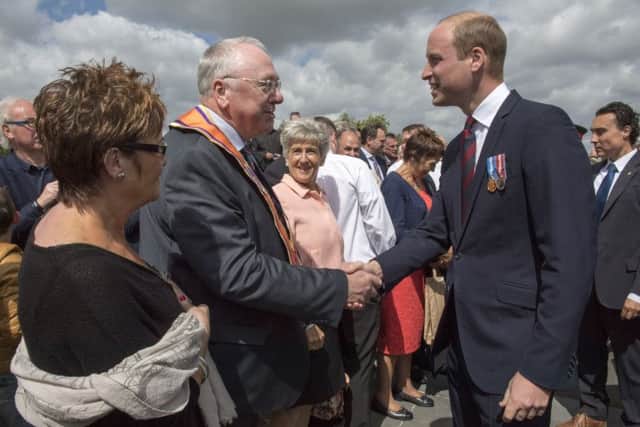 The Duke of Cambridge (right) meets the Grand Secretary of the Orange Order Reverend Mervyn Gibon following a ceremony at the Island of Ireland Peace Park in Messines, Belgium