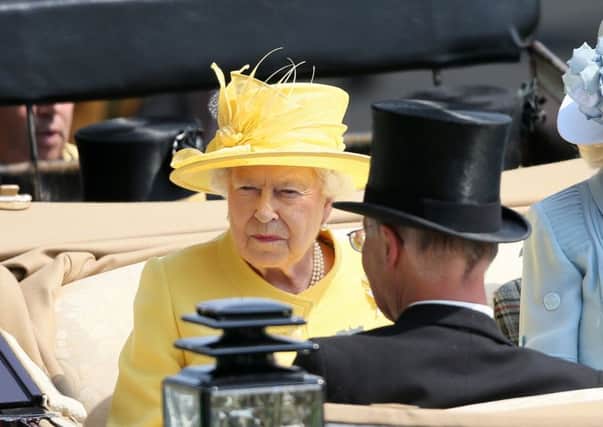 Queen Elizabeth II (left) arriving during day two of Royal Ascot at Ascot Racecourse following the formal opening of Parliament
