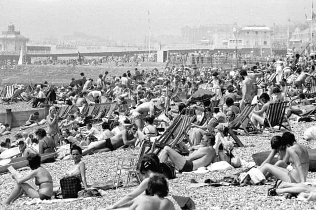 People sunbathing on Brighton beach on June 27 1976 as temperatures soared to 80F. The temperature has today, 41 years later, hit 34.5 (94.1F) at Heathrow in west London, making it the hottest June day since 1976, the Met Office has said. Photo: PA Wire