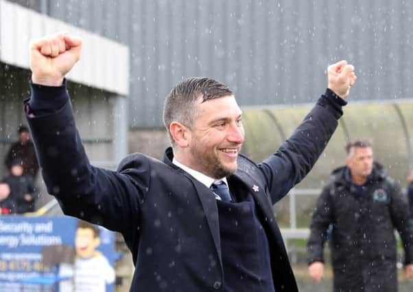 Matthew Tipton celebrates securing title success with Warrenpoint Town in the Championship. Pic by PressEye Ltd.