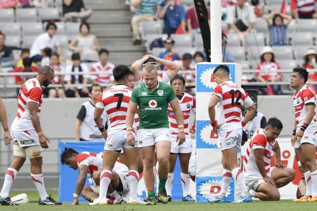 Japan's players look dejected after Ireland scored a try