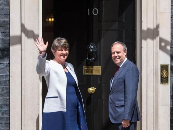 File photo dated 13/06/17 of DUP leader Arlene Foster and DUP deputy leader Nigel Dodds arriving at 10 Downing Street in London. Theresa May is still trying to cut a deal with the Democratic Unionists days before her minority Government attempts to get its Queen's Speech legislative package approved by the Commons