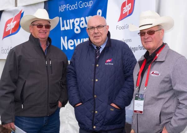 Liam McCarthy, ABP with Dave Longshort, Canada and Brian Good, Canadian Angus Association two of the Aberdeen Angus delegates at the ABP Newry Show for the All Ireland Angus Final.