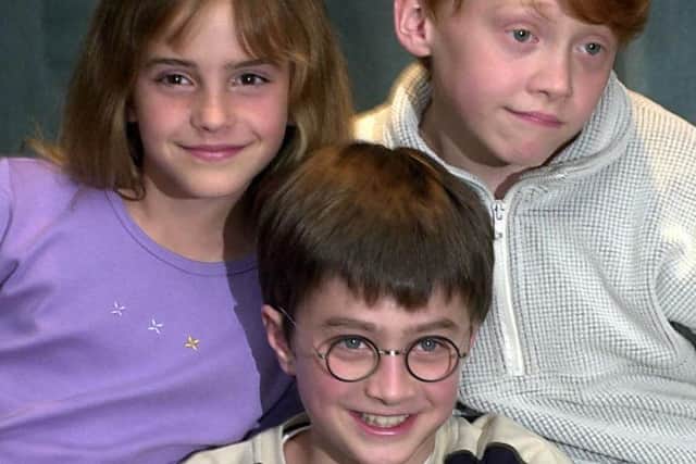 File photo dated 23/08/00 of Harry Potter actors (left to right) Emma Watson (Hermione Granger), Daniel Radcliffe (Harry Potter) and Rupert Grint (Ron Weasley), as Harry Potter fans around the world will today celebrate the 20th anniversary of the first book about The Boy Who Lived