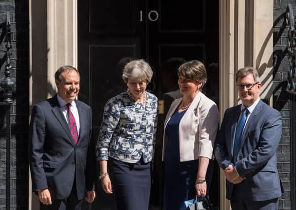 Prime Minister Theresa May, DUP leader Arlene Foster, DUP deputy leader Nigel Dodds and DUP MP Sir Jeffrey Donaldson outside 10 Downing Street in London today. PRESS ASSOCIATION Photo.