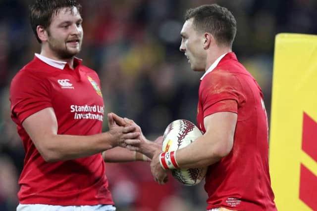 Lions' George North celebrates scoring their second try with Iain Henderson